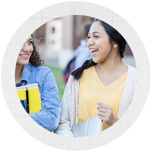 Two girl friends smiling with each other